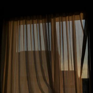 Soft morning sunlight streaming through a clean window